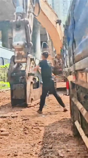 Excavator Bucket Installation: Man vs. Machine—Hammering into Place on Site