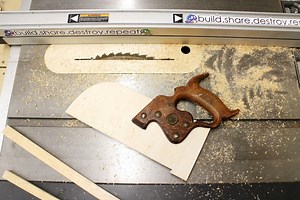 This push stick is styled to look like a short handsaw, with a notch at the back to help push material through the saw blade and a vintage handle from a very old handsaw. The best part is that the blade is removable, allowing you to swap it out for a new one when this push stick is no longer useful. https://www.instructables.com/id/Saw-Handle-Push-Stick/ | Instructables