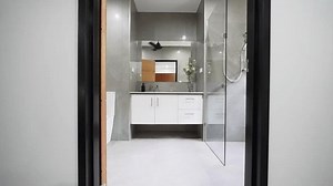 Modern tropical villa bathroom with clean white finishes, a spacious layout, and contemporary design for a luxurious feel.