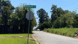 Man in critical condition after being shot while sitting in car