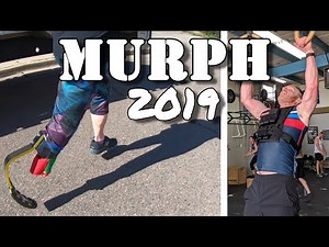 Murph - 1 mile run, 100 pullups, 200 pushups, 300 squats, 1 mile run