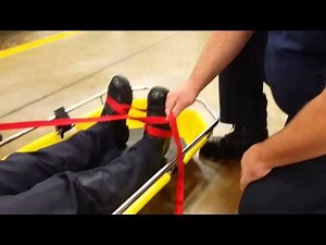 Patient strapped to Stokes