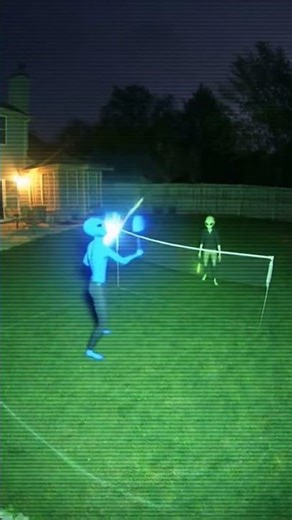 "Aliens Caught on Backyard CCTV Playing Badminton at Night – Impossible Footage!"
