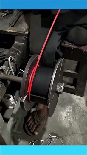 A compact cable winding tool that neatly rolls cords, keeping them organized and tangle free.