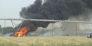 Fire engulfs combine harvester