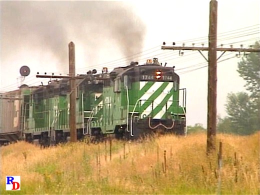 A set of ex Burlington Northern GP9s on a local freight wait for the Laurel to Missoula freight. Once the set of classic diesels, likely of Northern Pacific, CB&Q or Great Northern heritage gets the clear, we catch them in dramatic acceleration as they climb the west slope of Bozeman Pass. From the Pentrex show https://rfd.video/MontanaRailLink | Railfan Depot