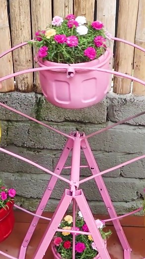 Watch How to Build a Ferris Wheel to Grow Flowers #fyp #foryoupage #learnontiktok #handmade #diy #ferris #wheel #garden #diybalconygarden