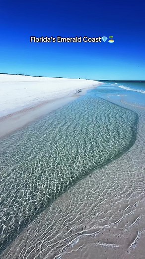 Florida's Emerald Coast extends from Panama City Beach to Pensacola Beach, celebrated for its beautiful waters and sugar-white sand. It includes beach communities along Highway 30A, as well as Destin, Okaloosa Island, Navarre Beach and more💎🏝️ #beach #travel #asmr #emeraldcoast