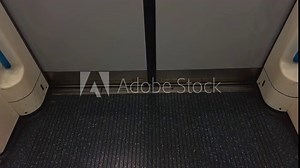 Experience the modern train interior featuring automatic doors that open and close seamlessly in stunning 4K