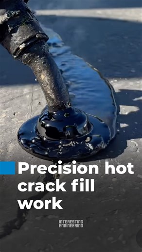 Hot asphalt crack sealing involves applying heated, rubberized bitumen into pavement cracks to prevent water penetration, slow further deterioration, improve surface durability, and extend the overall lifespan of roads, parking lots, and industrial pavement surfaces. | Interesting Engineering