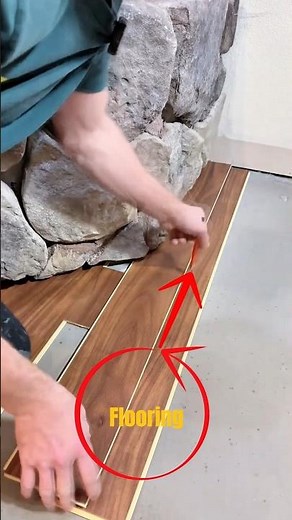 Perfect Contour Flooring Cut Around Stone Wall.