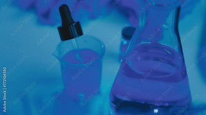 Female Research Scientist Uses Micropipette Filling Test Tubes. Scientist Works in a Team of Scientists Trying to Cure Deadly Disease, They Work in a Big Laboratory/ Research Center.