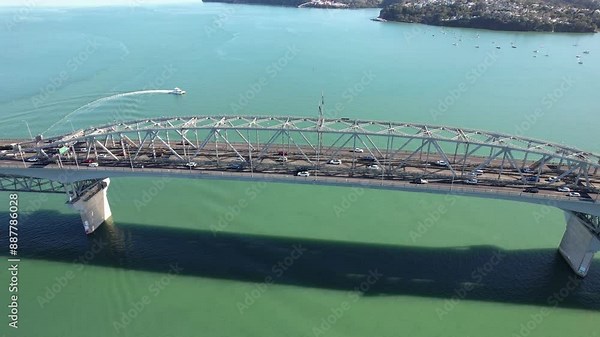 Auckland Harbour Bridge Spanning Waitemata Harbour On North Island, New Zealand. aerial sideways shot