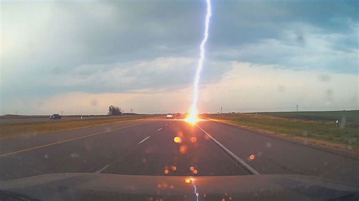 Nature's fury: Driver has shocking close call with lightning bolt