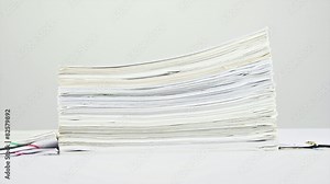 Stack old overload paperwork on table time lapse Stock Video