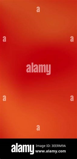 Abstract vibrant red background with soft gradient and blurred texture.