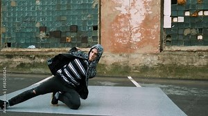 Hip-hop and breakdancing. Breakdancer dancing in the street. 4K