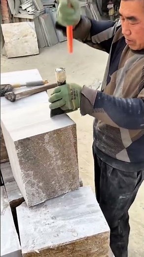Stone block shaping using hammer and chisel for a precise smooth edge finish