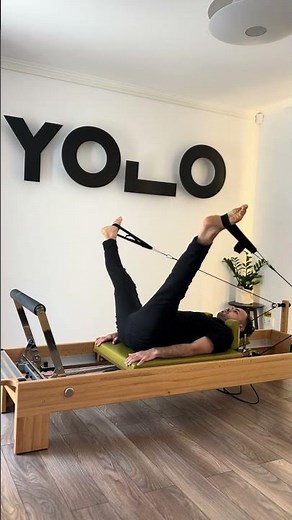 Feet in straps Pilates reformer