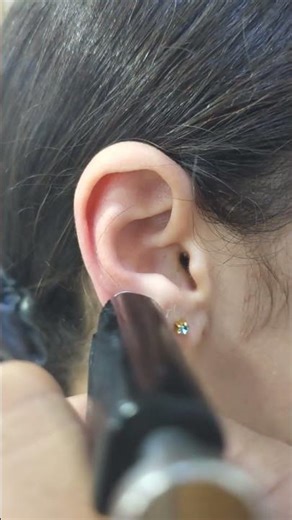 Young Moroccan Woman Gets Four Ear Piercings In One Sitting