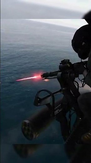 They are using an M134 Minigun to catch fish In Helicopter