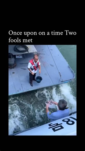 Learnbit.io on Instagram: "The post shares a 10-second video of a bungled marriage proposal on a Korean ferry, where an assistant uses a pan to hand over the ring, but it slips into the sea, leading to a frantic reach by the kneeling proposer in a red vest. Captioned "Once upon on a time Two fools met," it humorously reimagines a fairy tale as a tale of clumsy romance, likely referring to the proposer and helper as the "fools," evoking light-hearted schadenfreude. Posted on 5 January 2026, it qu