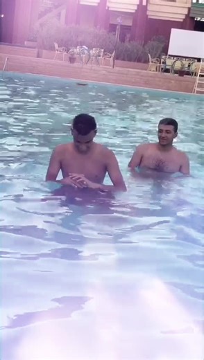 Shoulder Ride Challenge with Friends at the Pool