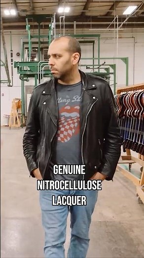 Mark Agnesi observes a Gibson Sunburst finish being sprayed