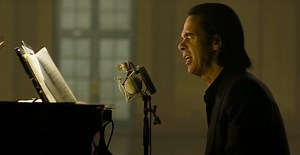 Nick Cave covers T. Rex's "Cosmic Dancer" on Corden: Watch