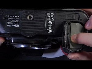 How To Access Battery Slot On NIKON D300