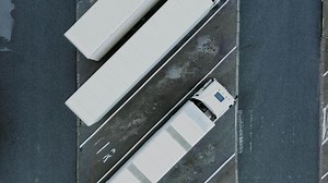 An overhead view of a truck driving on a road