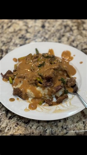 Tonight’s dinner is beef stew and gravy with lemon garlic asparagus and kale over a bed of mashed potatoes. #dinnerideas #steak #mashedpotatoes #fromscratch #gravy