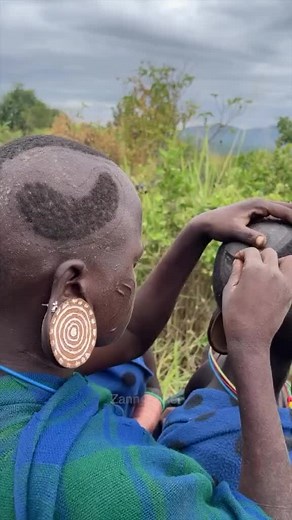 5K views · 41 reactions | Embracing tradition in the heart of Ethiopia's Omo Valley. Witness the Surma tribes' unique geometric haircuts, a blend of culture and craftsmanship. Each stroke tells a story, a timeless ritual captured in a single frame.  @zannparker #SurmaTribes #OmoValley #EthiopianCulture #Ethiopia #Africanculture #reelsTrending #Reelsinstagram | See Africa Today | Facebook