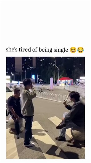 @braingrow_1 on Instagram: "The Instagram reel shares a viral video from early October 2025 depicting a woman in a white dress boldly giving a man a piggyback ride across a busy nighttime crosswalk in China, captioned "she's tired of being single " to emphasise her playful initiative in romance.With 81,000 views and 464 likes shortly after posting, it sparked humorous replies joking about skipping dating stages and "claiming" partners, reflecting its appeal as light-hearted relationship content.