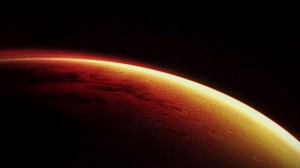 Planet Mars rotating in space with craters and a thin atmosphere