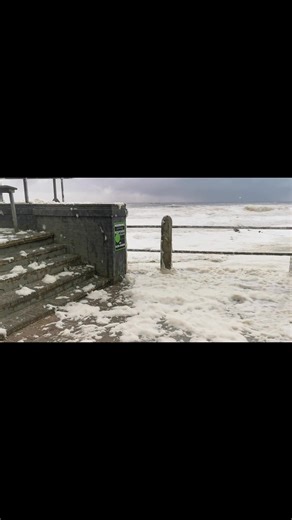 🌊 Nature’s power on full display — the sea reclaiming the shore with waves and foam flooding the promenade. A breathtaking reminder of how wild and unpredictable our oceans can be. 🌬️🌊 | Jay Bliss