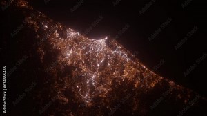 Durban (South Africa) top view at night. Aerial view on modern city from space. Camera is flying above the city, moving forward. Vertical video. The north is on the left side