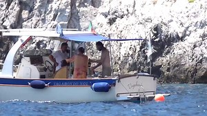 Shirtless Keanu Reeves hoses himself off with water, sips champagne in Italy