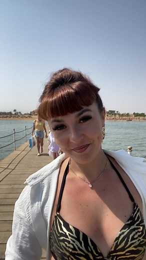 Woman in Zebra-Print Swimsuit Enjoys Beach Day
