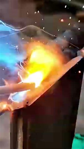 Blue White Flame Welds a Metal Joint as Sparks Fly from Clamped Pieces 🔥⚙️
