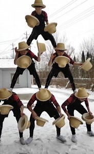 30K views · 623 reactions | Practice makes perfect. An acrobatic troupe displays immense talent in a show that combines a human pyramid with fancy hat juggling. #FunChina #Talent | China Plus Culture | Facebook