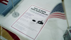 Close up of instruction on how to vote on the paper ballot lying on table at polling place. Elections in the United States of America. Presidential race and election coverage. Civic duty and democracy