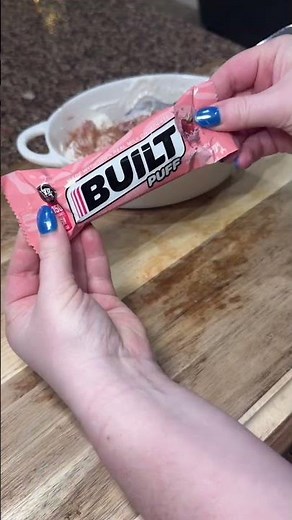 A quick and easy high protein low calorie snack! A vanilla Oikos pro (20g protein), a bunch of