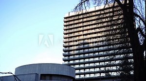 A stunning architectural shot of Karlovy Vary, showcasing its historic churches, clock towers, grand columns, and famous hot spring wells. The image captures the essence of this iconic spa town with i