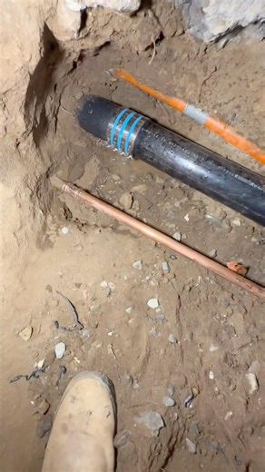 soft copper was caught in the crossfire while digging up this broken ABS pipe in the slab