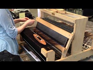 Bucky Lab weaving on a 8 shaft table loom