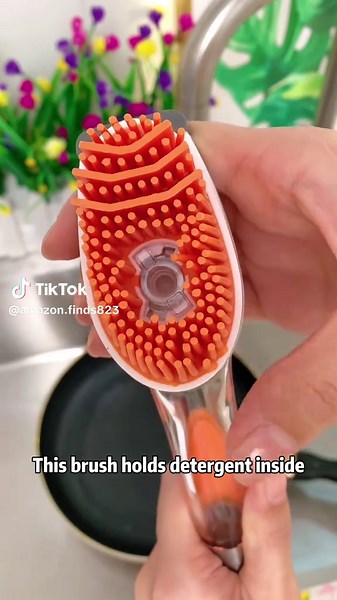 Ditch the soggy sponge! 🧽🚫 This soap-dispensing dish brush puts soap right where you need it—at the push of a button. The built-in reservoir holds your favorite dish liquid, and the ergonomic handle keeps your hands out of dirty water. Perfect for dishes, pots, pans, and sinks. Your kitchen routine will never be the same! ✨ #DishBrush #SoapDispensing #KitchenGadgets #NoMoreSponges #DishwashingHack