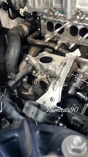 Car Engine Installation: Securing Parts Close-Up