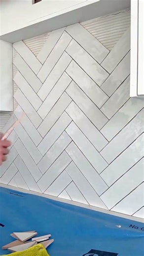 Elegant White Herringbone Tile Installation Transform Your Kitchen Walls