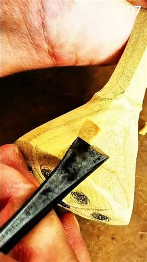Carving wood surface using chisel tool with precision